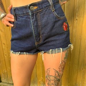 Rose-patch denim shorts